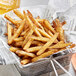 A basket of french fries seasoned with Regal Ultimate French Fry Seasoning.